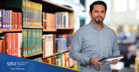person of color working in a library